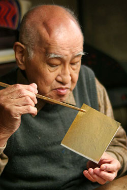 Elderly Artisan with Paper in Japan