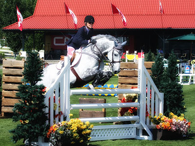 Katrina jumps on Horseback at Show